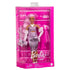 Barbie Deluxe Style doll in packaging, featuring long pink hair, shiny ruched pink dress, white boots, matching gloves, and pink money-themed clutch.