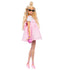 Side view of Barbie Deluxe Style doll in pastel pink dress, fishnet tights, pink heels, and sunglasses, holding a pink heart-shaped purse.