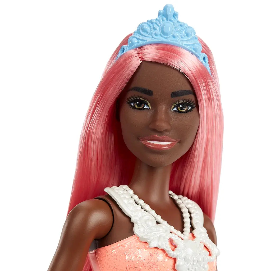Close-up of Barbie Dreamtopia princess doll's face with light pink hair, blue tiara, glittery makeup, and friendly smile for imaginative fairytale play.