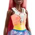 Detailed view of Barbie Dreamtopia doll’s glittery pink and yellow bodice with white pearl-like molded necklace and colorful layered fantasy skirt.