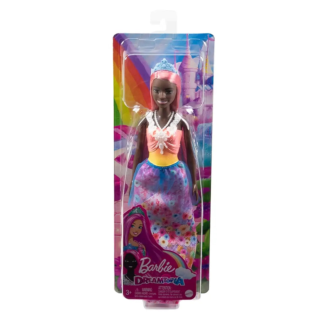 Barbie Dreamtopia princess doll in original packaging, featuring pink hair, blue tiara, multicolored top, and floral rainbow skirt with fantasy castle background.