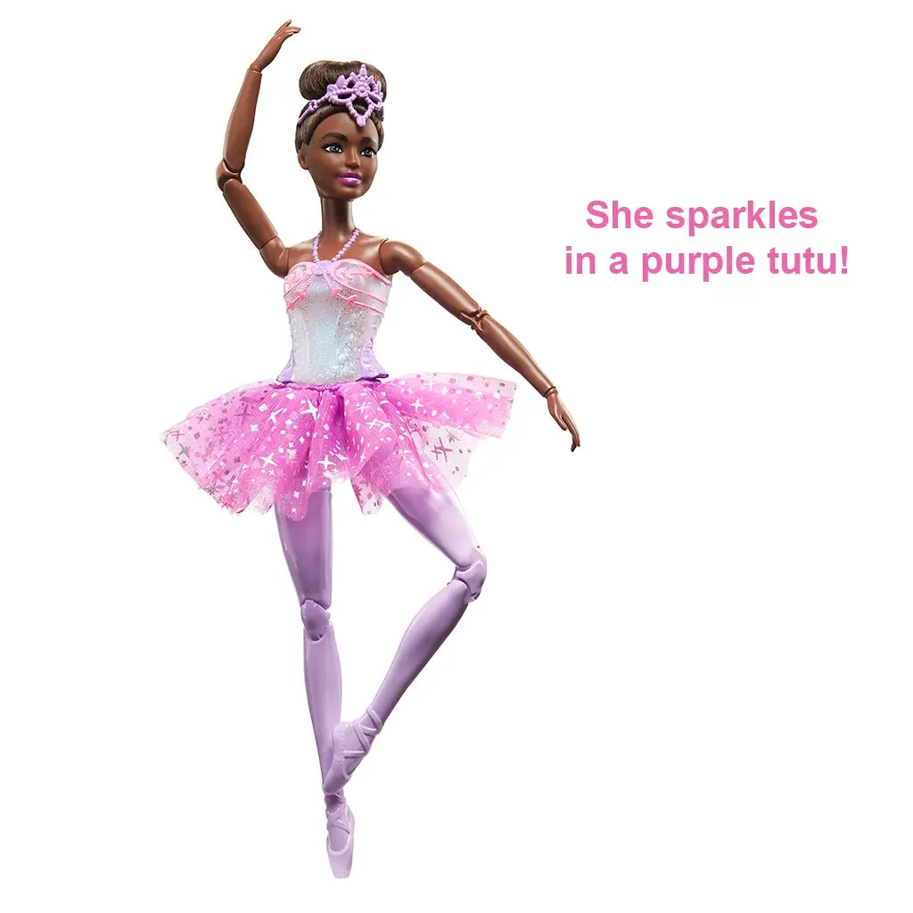 Barbie Dreamtopia ballerina doll in elegant ballet pose, dressed in a glittery pink and purple tutu, lavender tights, and tiara, with sparkling bodice.