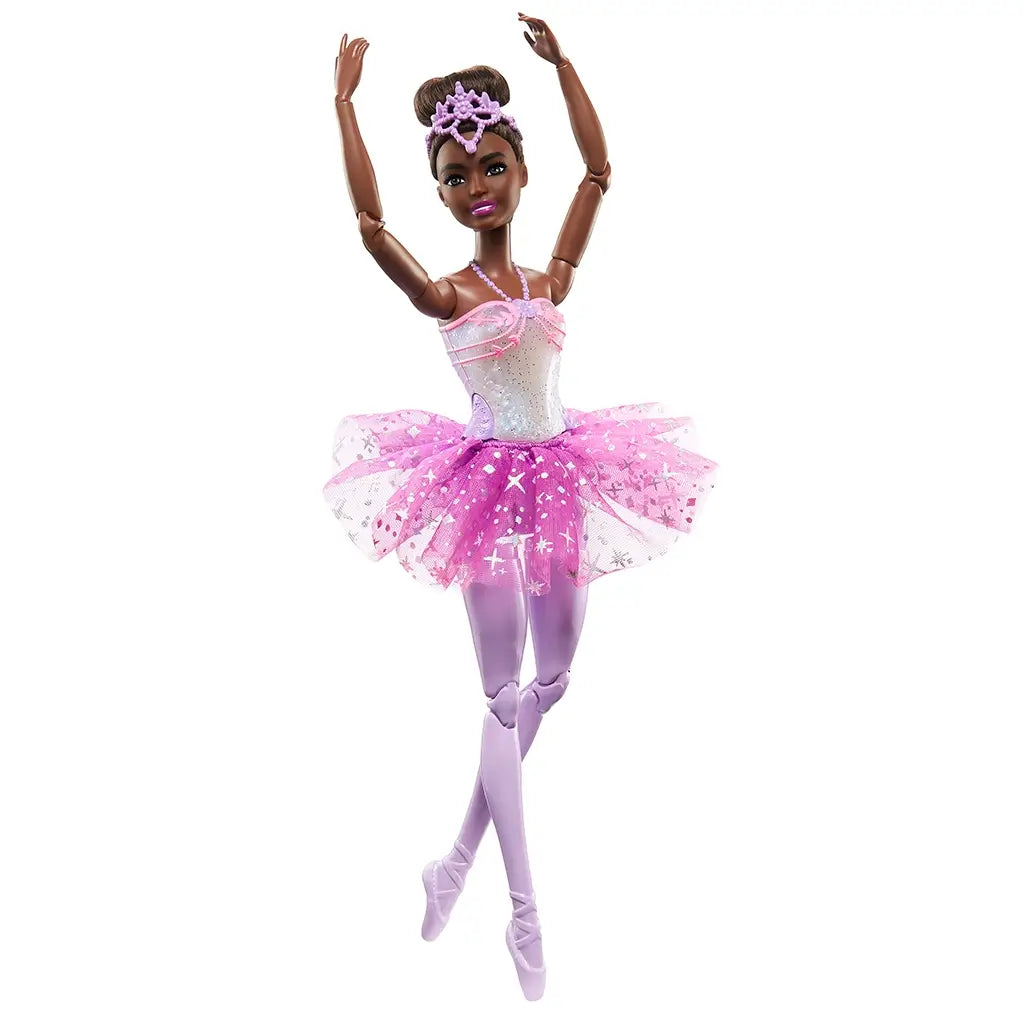 Barbie Dreamtopia ballerina doll wearing a sparkly pink and purple tutu, lavender tights, tiara, and ballet shoes, posed gracefully en pointe.