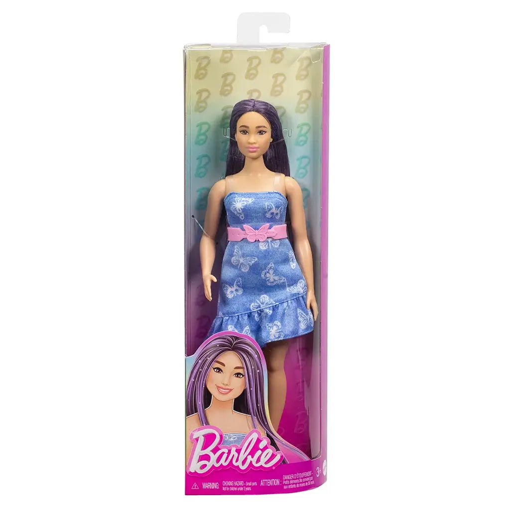 Barbie Fashionistas doll in retail packaging, wearing a blue denim butterfly-print dress with a pink bow belt, long straight purple hair, and pink cowboy boots.
