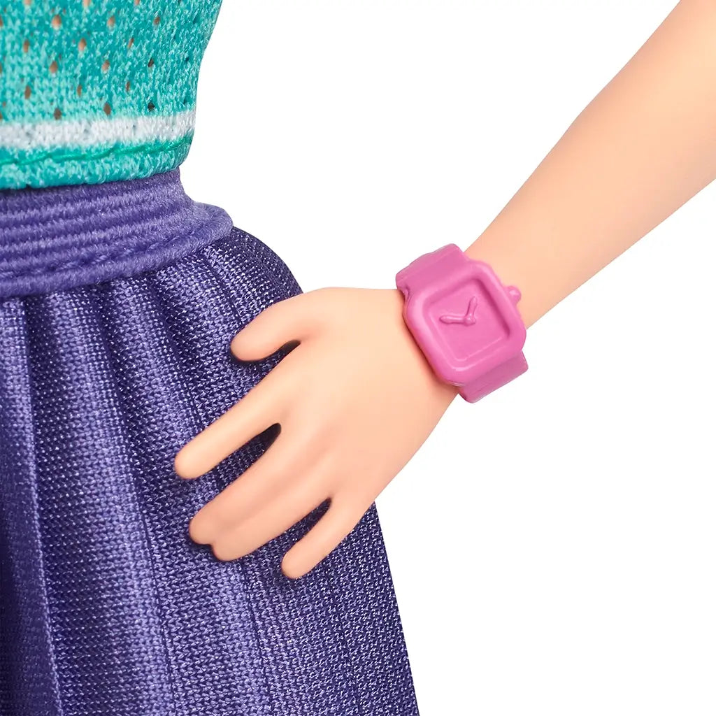 Close-up of Barbie Fashionistas 232 doll showing pink wristwatch accessory paired with pleated purple skirt and teal jersey top with magenta trim.