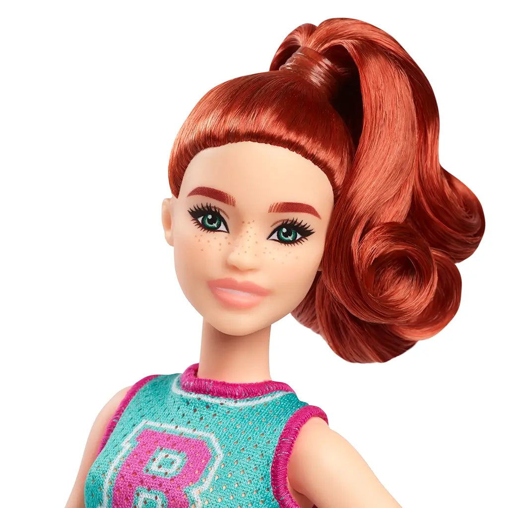 Close-up of Barbie Fashionistas 232 doll’s face with freckles, green eyes, and bright red hair in voluminous high ponytail, wearing sporty sleeveless top.