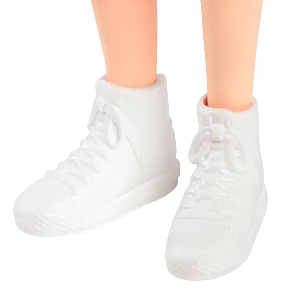 Close-up of Barbie Fashionistas 232 doll’s molded white sneakers with textured laces and soles designed for casual sporty styling.