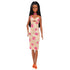 Barbie Fashionistas 233 doll standing, wearing a yellow and white checkered midi dress with pink flowers, orange platform sandals, and a pink bead necklace.