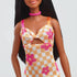 Close-up of Barbie Fashionistas 233 doll’s yellow and white checkered midi dress with pink flowers, featuring a knotted bodice and cutout detail.