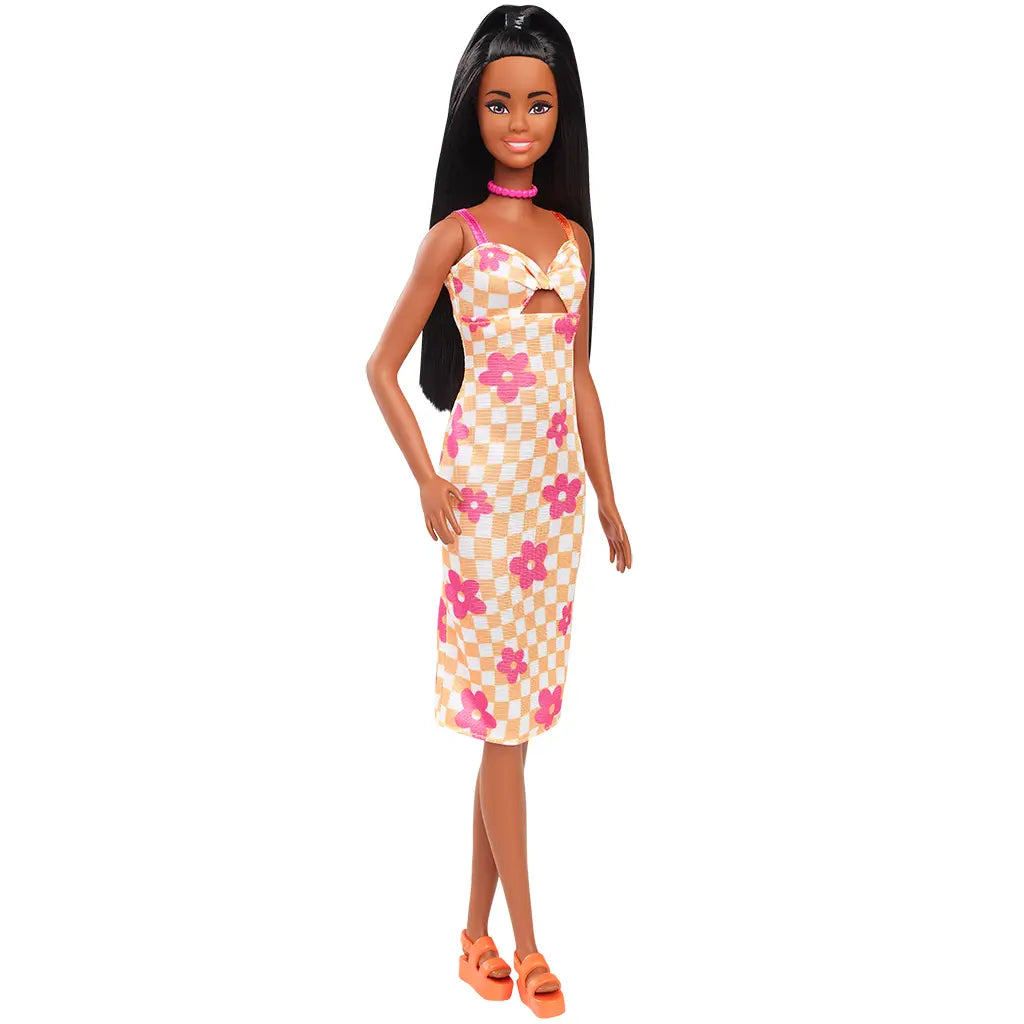 Barbie Fashionistas 233 doll posed at an angle, dressed in a yellow and white checkered midi dress with pink flowers, orange platform sandals, and pink bead necklace.