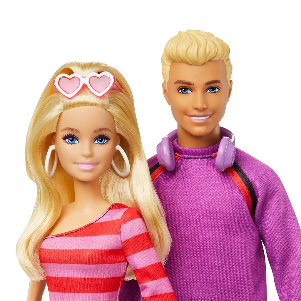 Barbie and Ken dolls with a pink and red striped dress and purple sweater on a white background