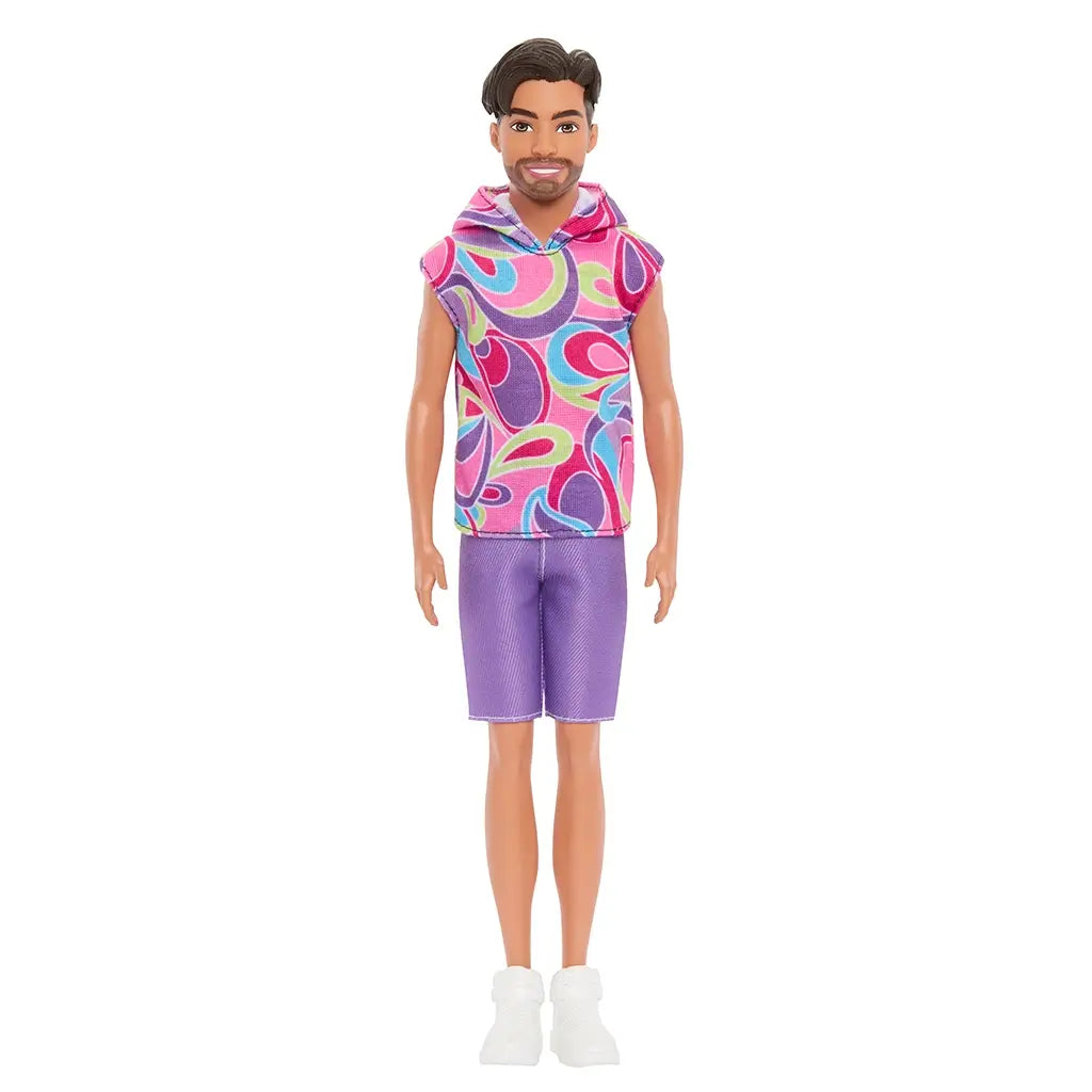 Front view of Barbie Fashionistas Ken doll #227 in sleeveless multicolor swirl hoodie, purple shorts, and white sneakers.