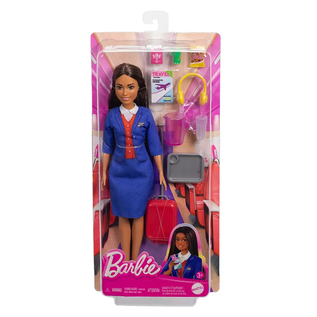 Barbie flight attendant doll in packaging, wearing a blue skirt suit with red vest, displayed with suitcase, headphones, travel magazine, snacks, and drinks.
