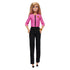 Front-facing view of Barbie Future Leader doll wearing pink jacket and black trousers with gold bracelet, styled with blonde hair and black shoes, designed for empowerment play.