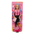 Barbie Future Leader doll packaged in box with pink political campaign background, wearing pink jacket and black pants, holding sign that reads Future Leader for kids’ empowerment.