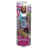 Barbie doll packaged in retail box wearing shimmering blue evening dress with ruffle trim, illustrated branding and pink Barbie logo visible on the lower portion of the package.