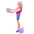 Barbie doll posed standing with blue headphones and holding a silver laptop, with a lilac backpack at her feet, styled for creative school-themed pretend play fun.