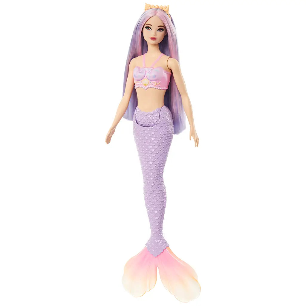 Barbie mermaid doll shown from an angled view, featuring shimmering lilac hair, a pastel pink seashell bra top, and a lavender tail with a large ombre fin. Designed for imaginative play, this Barbie mermaid doll blends colorful fantasy details with a shimmering aquatic theme, perfect for collectors or kids.