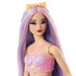 Closeup of Barbie mermaid doll’s face, highlighting her lilac hair with pink streaks, golden crown, red lipstick, and pink seashell top with pearl trim. Designed for imaginative play, this Barbie mermaid doll blends colorful fantasy details with a shimmering aquatic theme, perfect for collectors or kids.