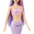 Closeup of Barbie mermaid doll’s torso, showing pink seashell bra with gold seashell detail, pearl-like trim, and lavender scale-patterned mermaid tail. Designed for imaginative play, this Barbie mermaid doll blends colorful fantasy details with a shimmering aquatic theme, perfect for collectors or kids.