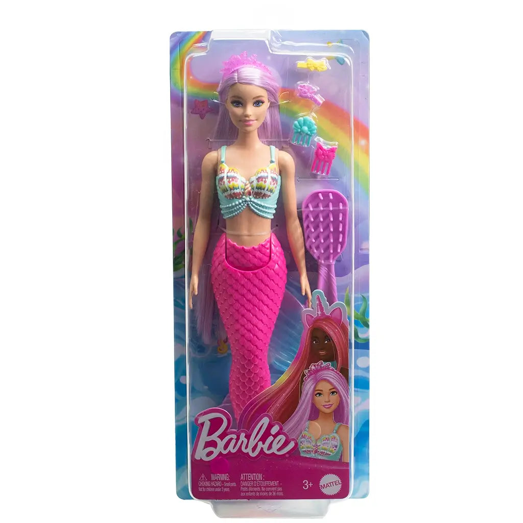 Barbie mermaid doll in original packaging with pastel shell top, long pink hair, sculpted pink tail, and accessories including combs and decorative barrettes.