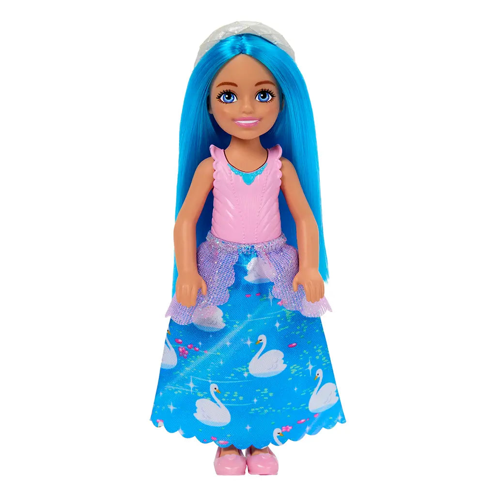 Barbie Chelsea doll front view showing blue hair, silver headband, pink top with textured details, and full-length swan-patterned skirt with purple glitter accents.