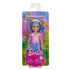 Barbie Chelsea doll in retail packaging with rainbow background, wearing blue swan skirt and pink top, displayed in clear plastic window with Barbie logo at bottom.