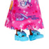 Closeup of Barbie Chelsea doll’s lower skirt hem with scalloped edge, showing colorful dog and gift box designs, paired with glossy blue shoes featuring large bows.