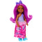 Full view of Barbie Chelsea doll with magenta hair, purple bow, lilac top, pink tutu, long pink skirt featuring dog print, and bright blue bow shoes.