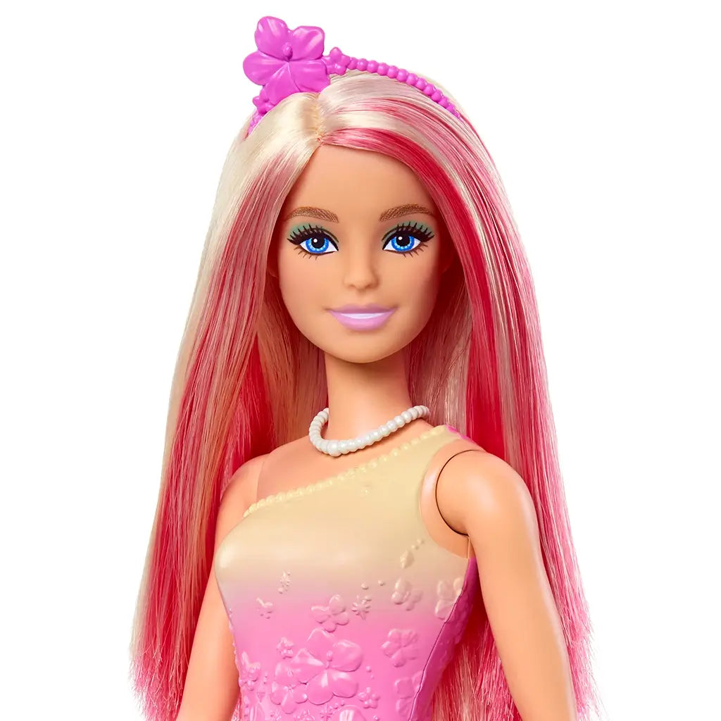 Barbie doll close-up highlights long pink-and-blonde hair, blue eyes, pearl necklace, and a floral pink bodice with textured details, accessorized by a butterfly-shaped headband.