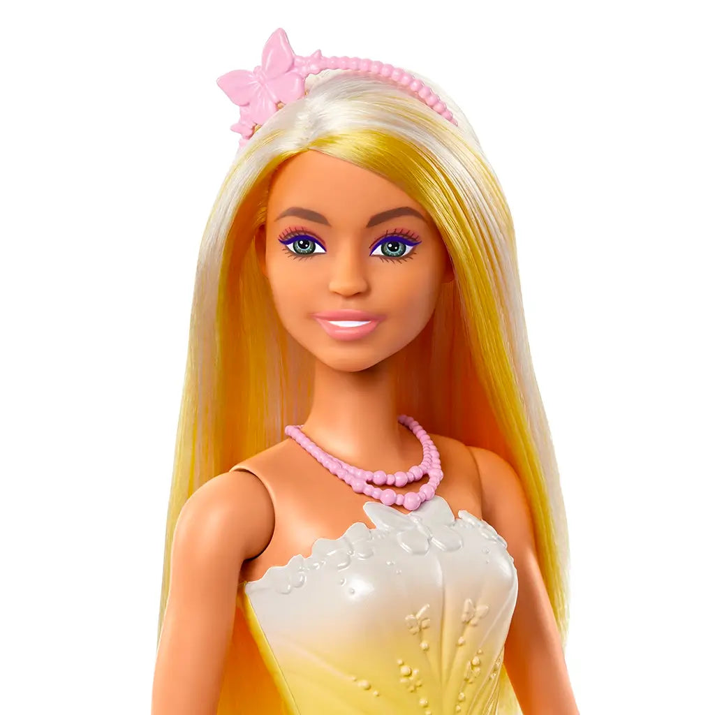 Close-up of Barbie doll’s face showing vibrant makeup, pink lips, violet eye shadow, and long straight hair with a butterfly headband and pink beaded necklace, highlighting her fantasy-inspired styling.