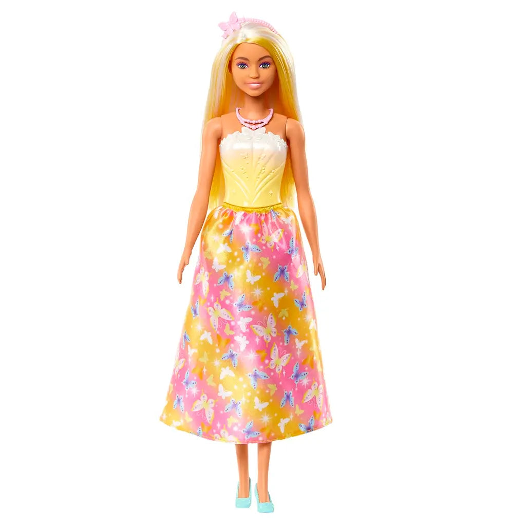 Barbie fashion doll shown from the front, dressed in a yellow bodice with white detailing and a satin skirt decorated with multicolored butterflies and stars, wearing mint high-heeled shoes.