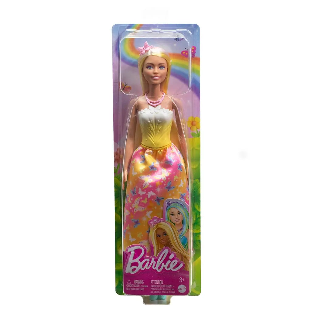 Barbie doll in original retail packaging, displayed in a clear box with a rainbow and flower background, wearing a yellow and white bodice with a butterfly-print skirt and pink accessories, labeled for ages 3+.