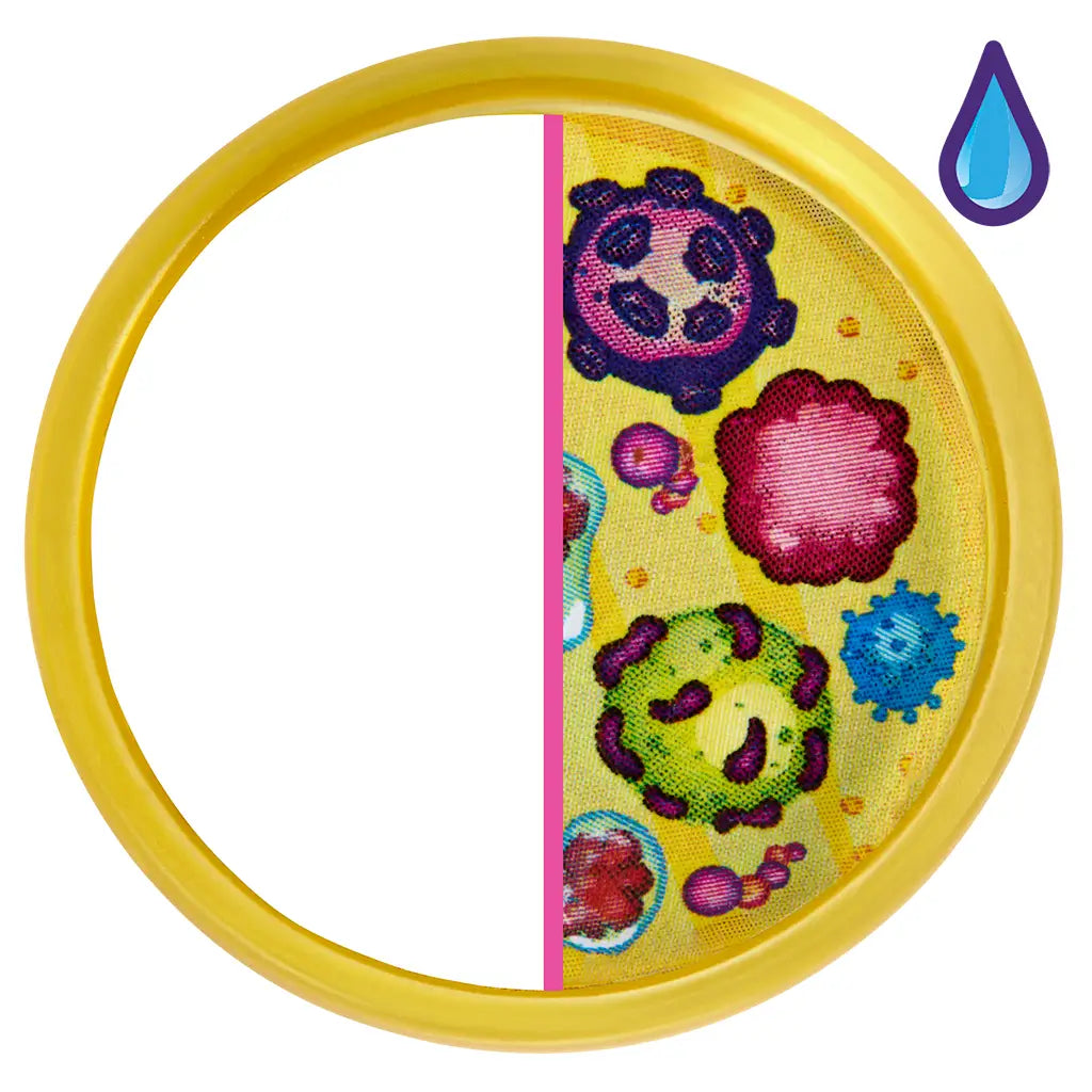 Barbie scientist playset accessory showing a round yellow-framed petri dish with half the surface covered in colorful illustrated germs on a bright yellow background for science-themed play.