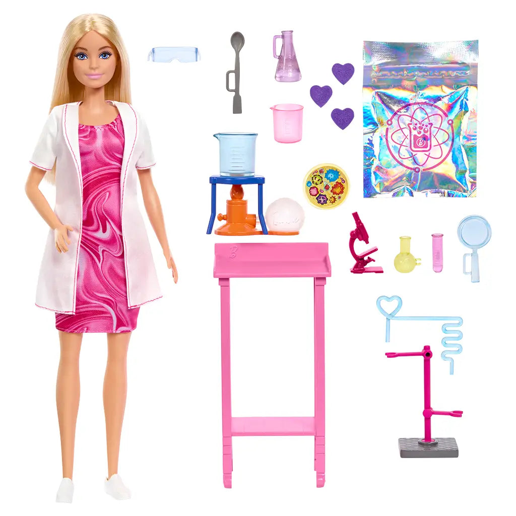Barbie Scientist Doll and accessories set displayed outside the box, including pink lab table, toy beakers, microscope, petri dish, and colorful experiment pieces for STEM-inspired play.