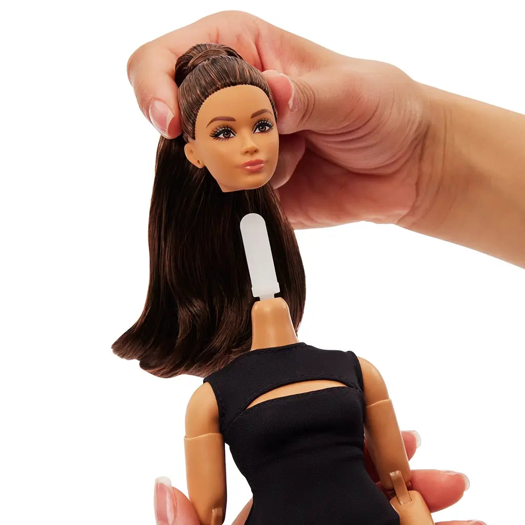 Close-up of Barbie Signature Basics Model 05 doll showing detachable head and neck connector, designed for easy customization and poseability.
