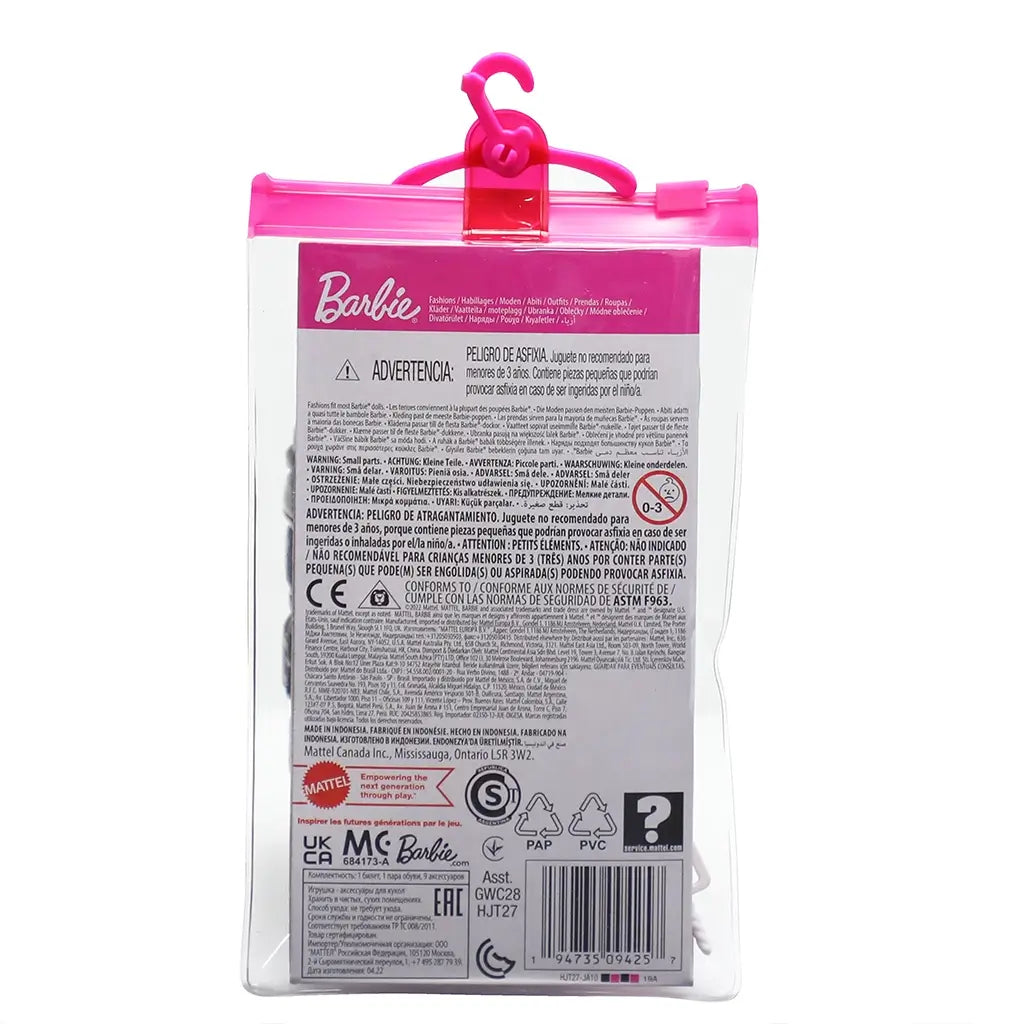 Back of Barbie tourist accessory pack showing detailed text, multilingual warnings, and barcode beneath signature Barbie logo and pink hanger.