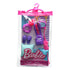 Barbie tourist accessory pack in clear pink hanger pouch containing purple scrunchie, cat-ear headband, pillow, backpack, slippers, and matching travel accessories.