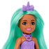 Close-up of Barbie Chelsea doll highlights her bright green hair, lavender unicorn headband, pink lipstick, and purple molded top with detailed unicorn necklace design.