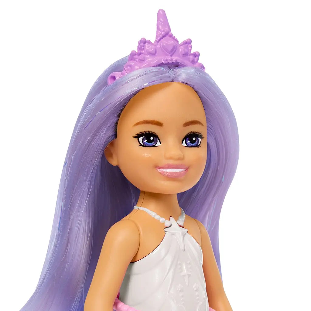 Close-up of Barbie Chelsea doll’s smiling face, long lavender hair, purple eyes, pink lipstick, and pink unicorn-style crown headband.