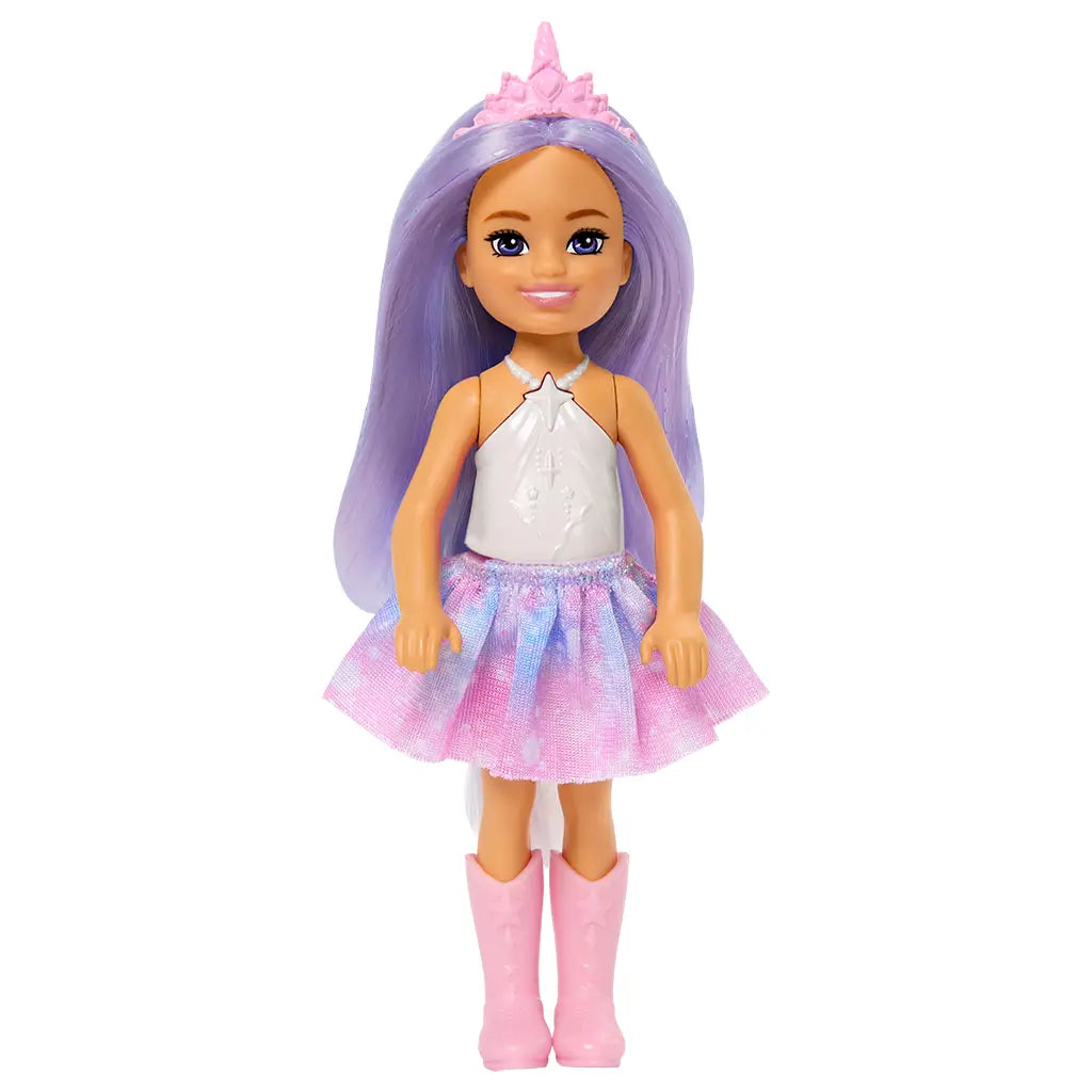 Front view of Barbie Chelsea doll with long lavender hair, pink crown headband, white top, pastel pink and blue skirt, and matching pink boots.