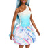 Barbie doll outfit close-up showing blue and white one-shoulder top with molded star details, paired with a printed rainbow skirt with stars and unicorn graphics.