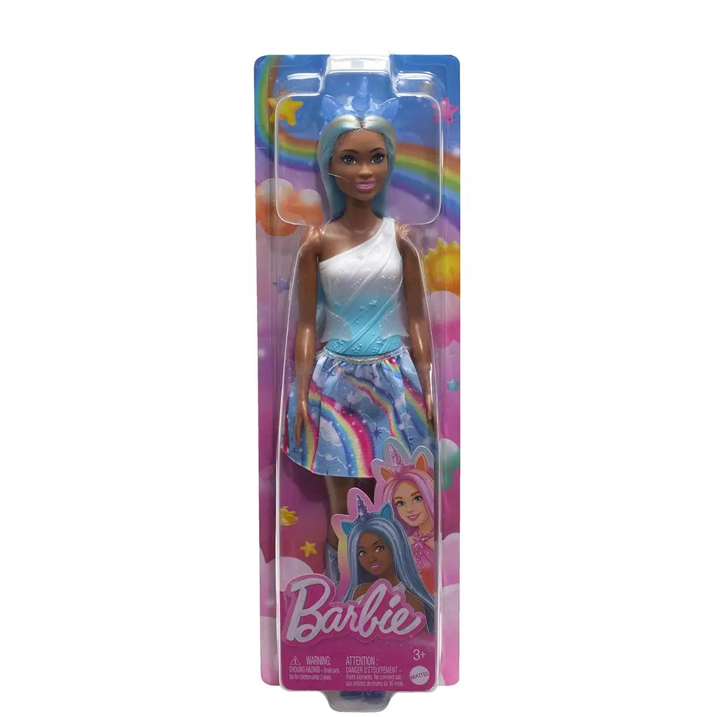 Barbie unicorn doll in original packaging wearing a blue and white ombre top, rainbow skirt, and blue boots, with unicorn headband and long pastel hair.
