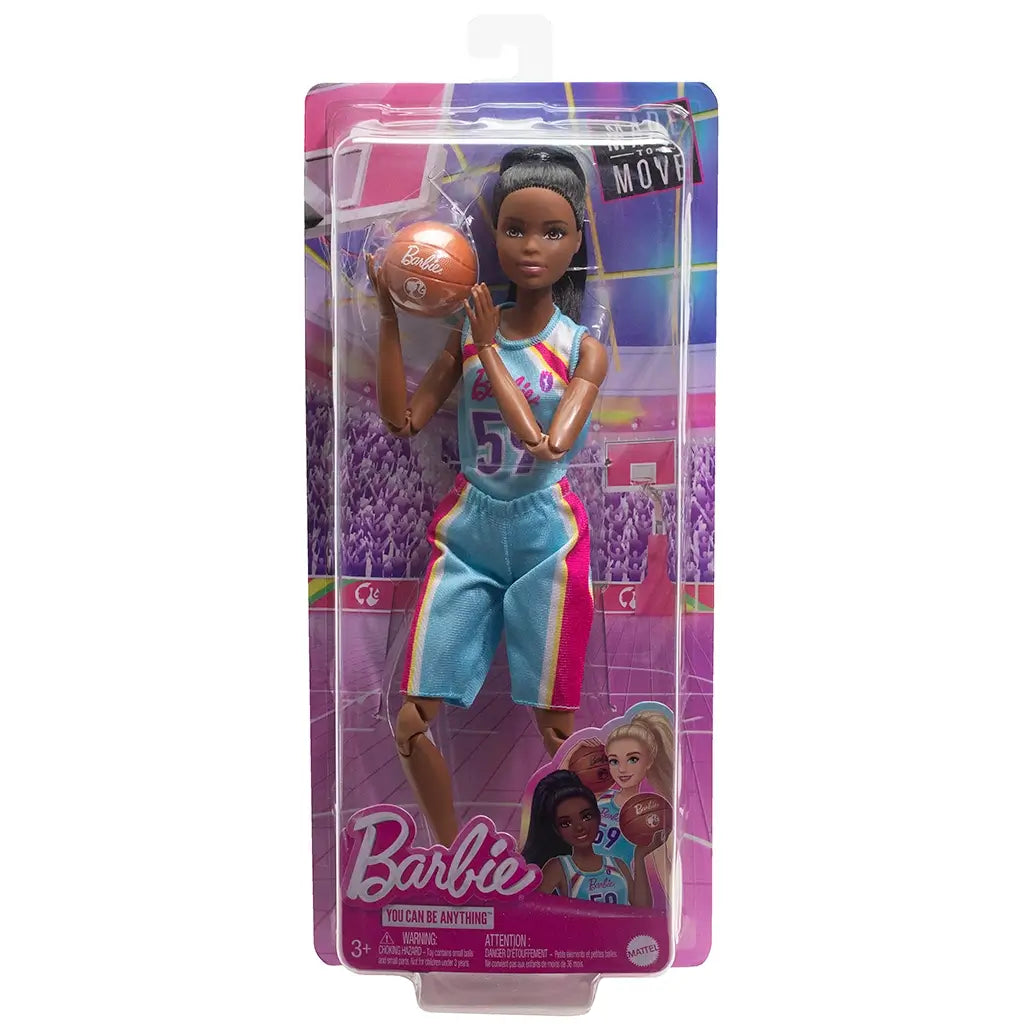 Barbie Made to Move basketball player doll in original packaging, wearing a blue and pink jersey with number 59, holding a basketball and posed in action on a court background.