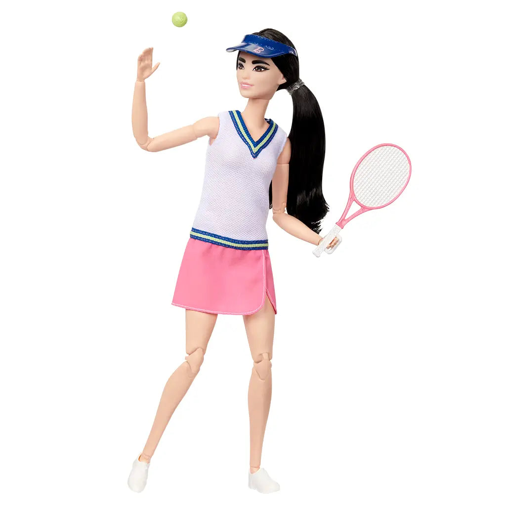 Barbie tennis player doll in motion, dressed in sporty white top and pink skirt, tossing a green ball while holding a pink racket, showcasing 22 joint articulations.