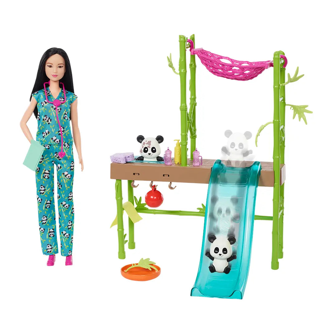 Barbie doll in panda-print scrubs stands beside panda care playset with bamboo design, hammock, slide, and toy pandas, highlighting interactive storytelling possibilities.