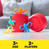 Close-up of the classic Barrel of Monkeys red barrel surrounded by colorful plastic monkeys in blue, yellow, orange, pink, and teal.