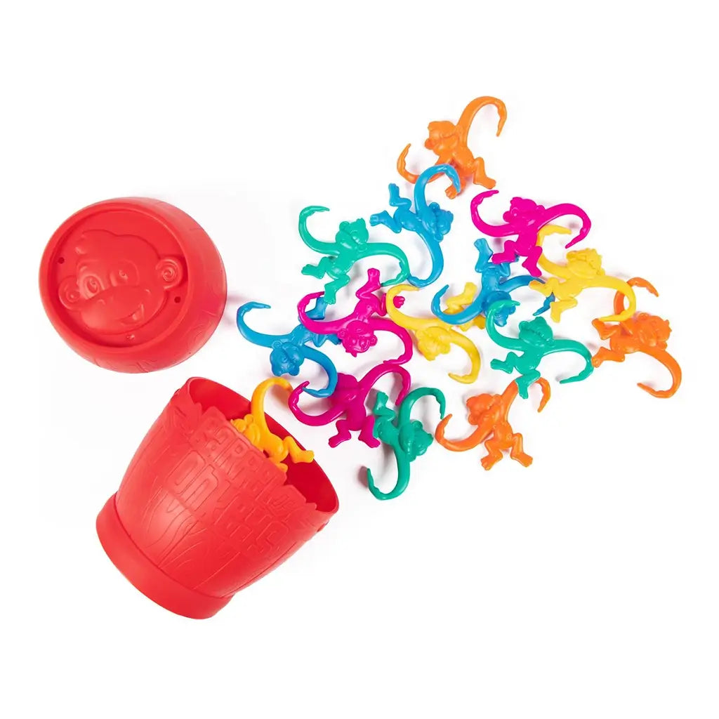 Classic Barrel of Monkeys red container tipped over with colorful monkey pieces spilling out, displaying all the game components.
