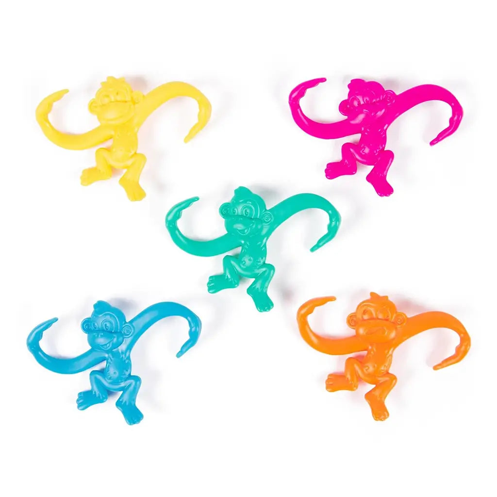 Five colorful monkey game pieces—yellow, pink, teal, blue, and orange—laid flat to highlight their fun curved-arm design.