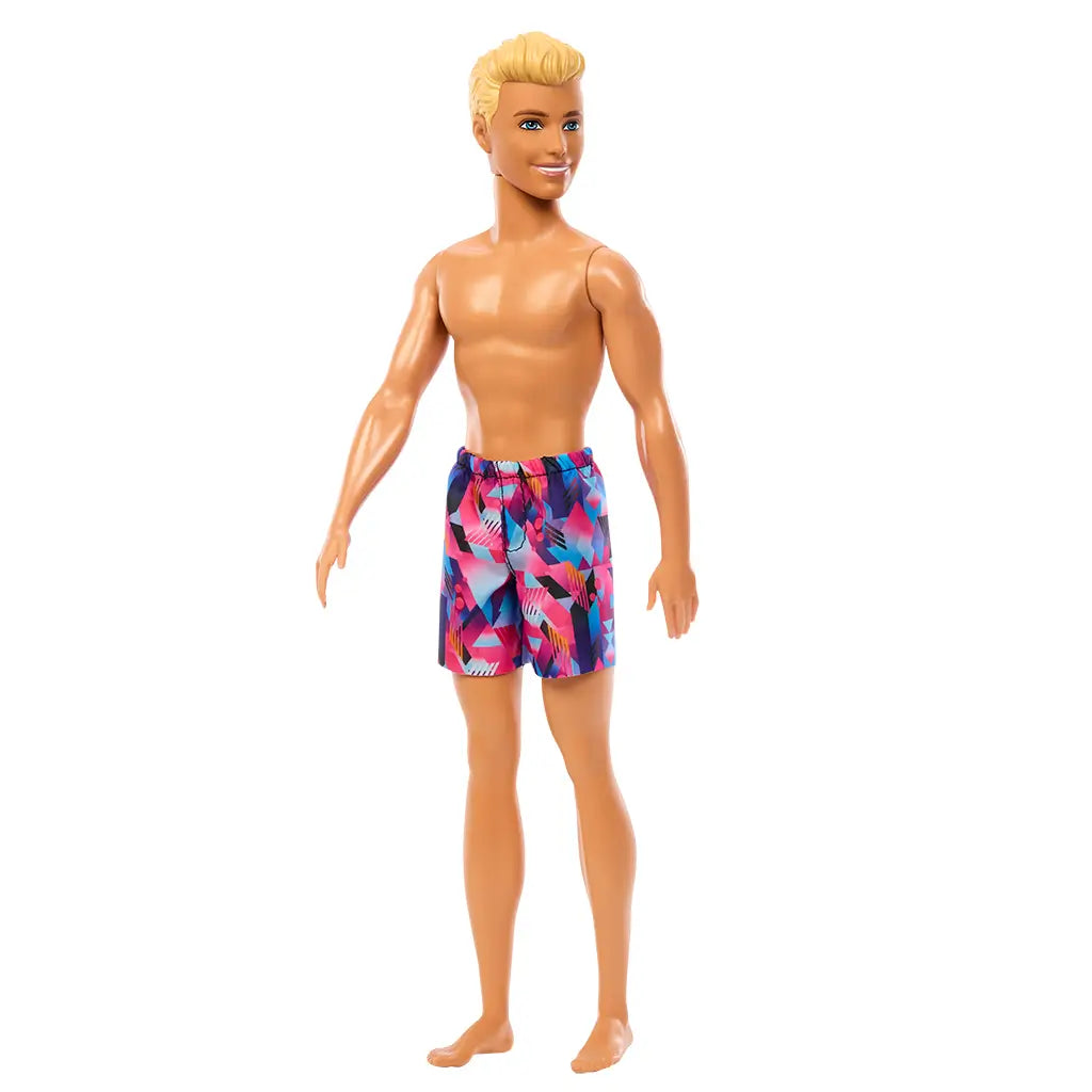 Side-angled view of Beach Ken doll with blond hair, colorful geometric-patterned swim trunks, and a friendly smile.